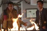 In an article about holiday movies, a screenshot of 'A Very Harold & Kumar Christmas.'