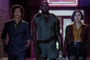 Three characters in sci-fi clothing are walking together in this screen shot of the live action "Cowboy Bepop."