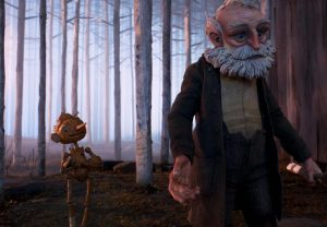 In an article about Guillermo del Toro's film 'Pinocchio,' the marionette and his father roam through the forest.