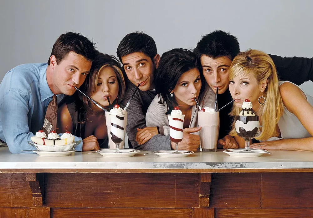 The cast of one of the most popular sitcoms of all times,"Friends" pose together for a photo while drinking sundaes.