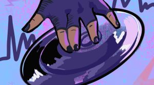 In an article about the origins of techno music, a Black person's hand spins a record.