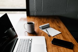 In an article about becoming a personal assistant, a laptop sits on a desk.