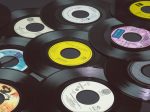 In an article about vinyl record supply issues, a photo of a pile of vinyl records.