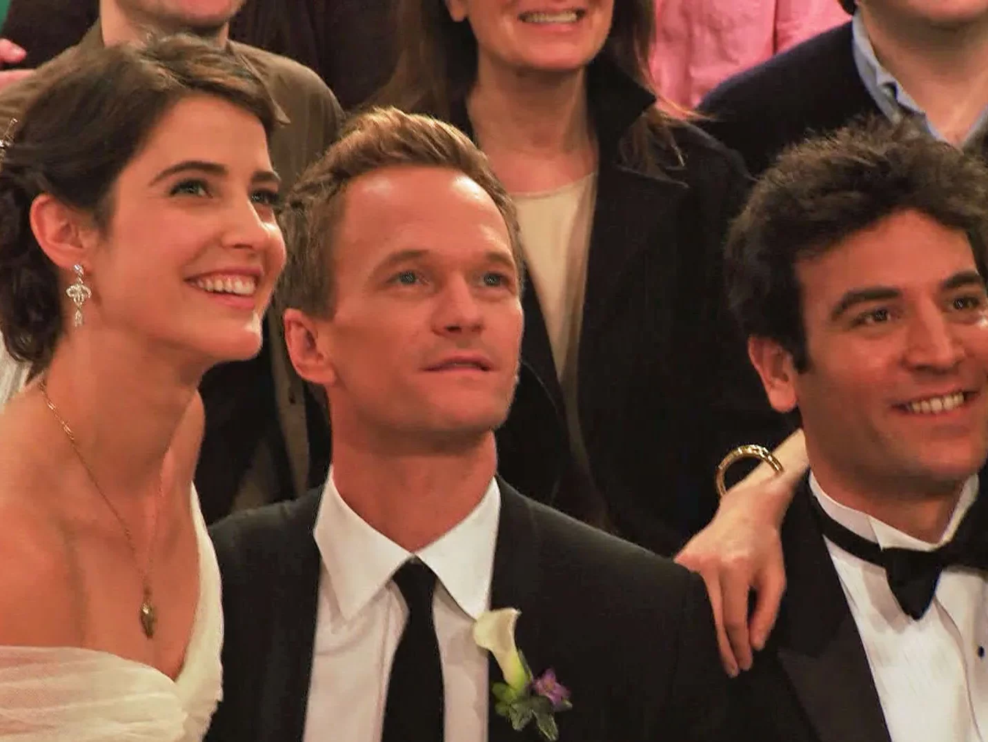 In an article about the series finale of "How I Met Your Mother," a picture of three of the main characters, Robin, Barney, and Ted