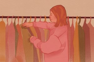 In an article about Gen Z's fashion sense, a young girl sorts through a rack of clothes.