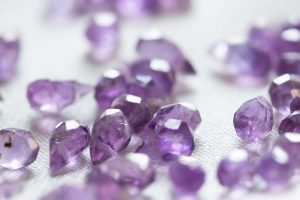 In an article about a diamond course, a pile of purple gems.
