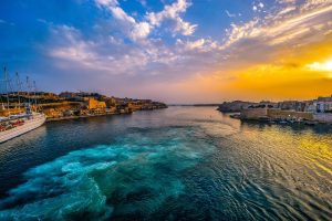 In an article about the casino industry in Malta, a beach in Malta.