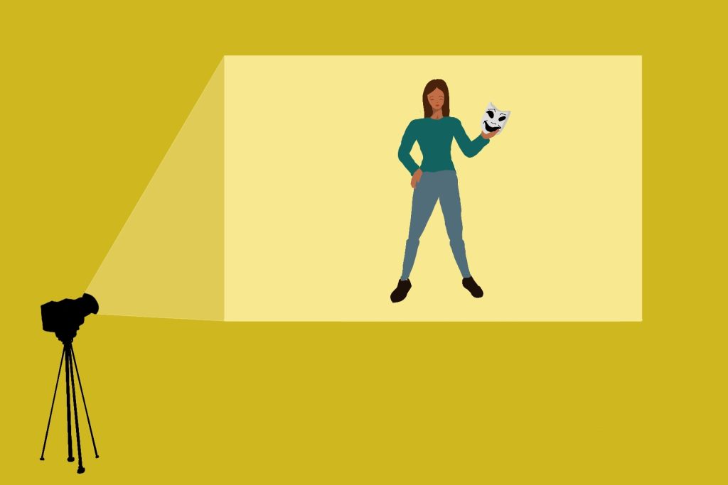 In an article about female-led comedies, a projection of a woman holding a comedy mask appears on a yellow wall.