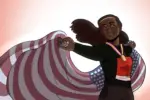 In an article about Tori Bowie and maternal mortality, an American flag streams out behind the gold medal-wearing Olympian.