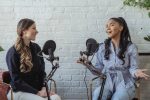 Two women talking on a podcast.