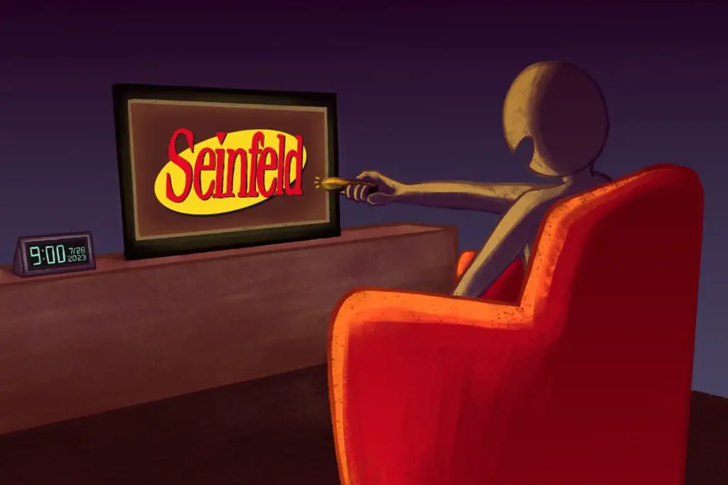 In an article about 'Seinfeld,' a person shrouded in the dark of night reclines in an orange chair and points the remote at a television screen lit up by the 'Seinfeld' logo.