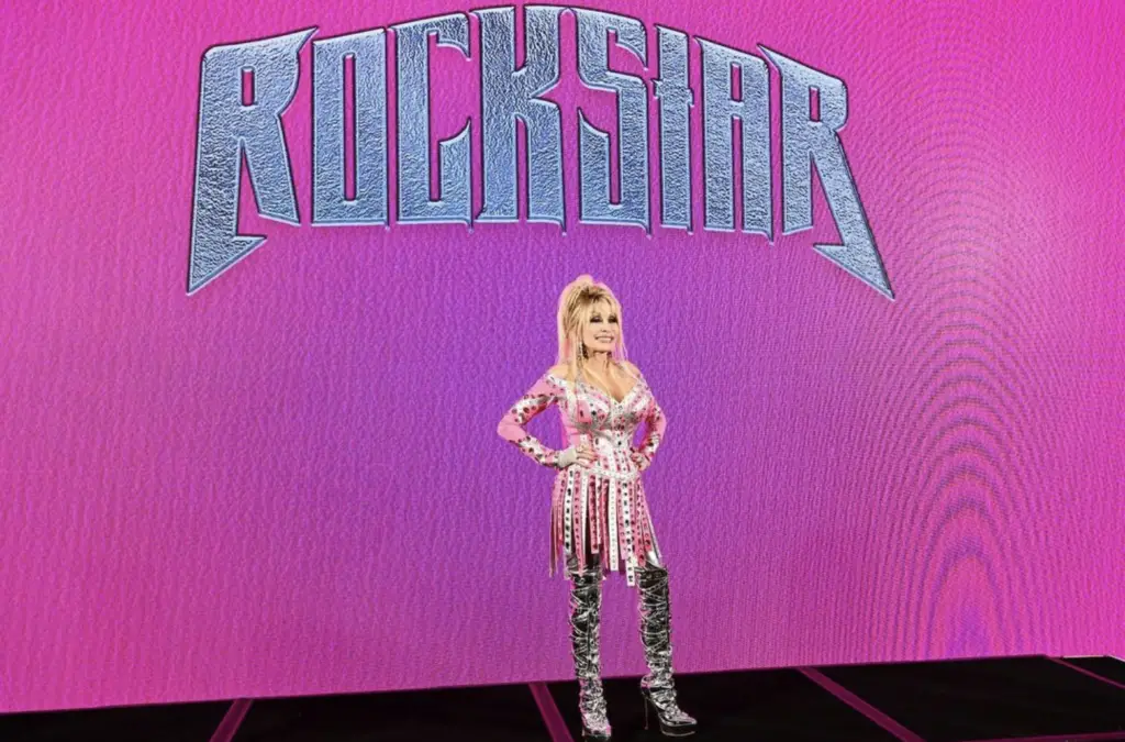 In an article about Dolly Parton, a woman with blond hair and sparkly pink outfit stands in front of a bright pink background. The phrase "rockstar" is bright above her head