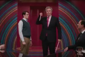 In an article about Mattel's use of self deprecation, a still from the 'Barbie' movie. Will Ferrel portrays Mattel CEO. He Stands in a black suit at the center with a pink tie. He carries a letter opener in his hand.