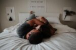 In article about casual relationships couple in white bed.
