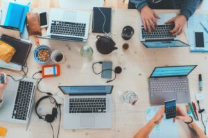 In story about study distractions computers and cell phones on a table.