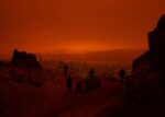 In an article about dystopia novels, the San Francisco cityscape is seen through a cloudy red haze.