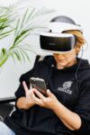In an article about the evolution of online gambling woman in VR headset on the phone