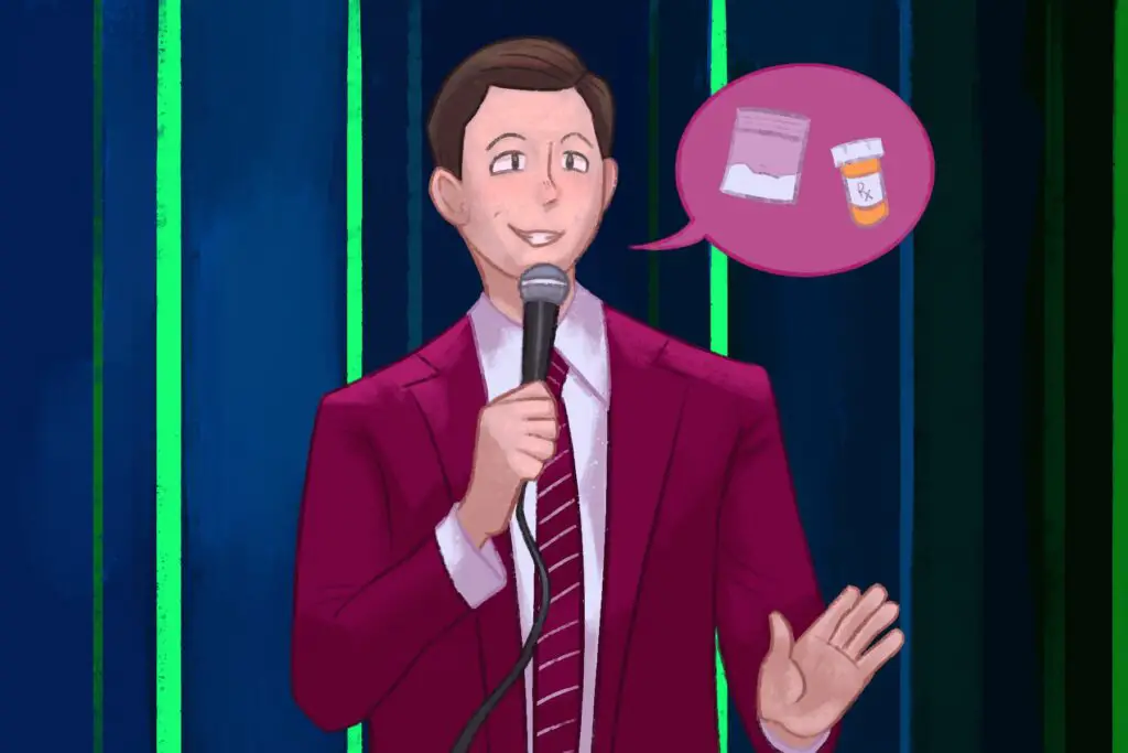 In an article about John Mulaney's controversies and comedy career, a man stands with a red suit on and red tie. He holds a microphone as a word bubble is beside his face with a bag of white powder and pill bottle.
