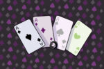 In an article about the asexual representation of "Aces Wild," a hand of Ace cards is on display in black, purple, pink, and green.