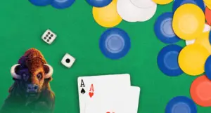 In an article about online poker 2 aces and chips on a poker table.