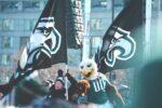 In a story about the philadelphia eagles fans with mascot and flag
