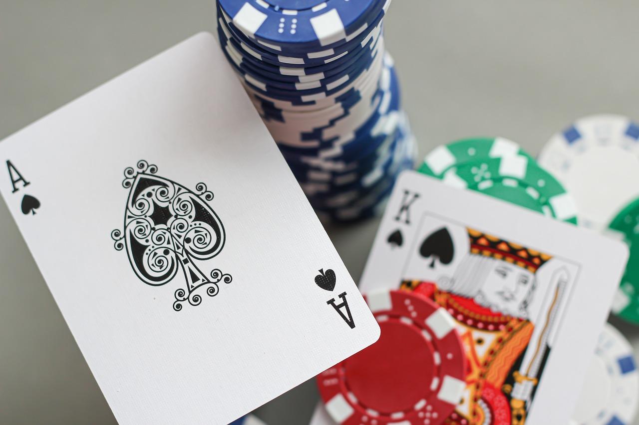 In a story about online casino gambling a photo of an ace of spades and chips.