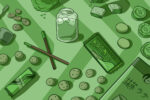 In an article about the commodification of Matcha, Matcha snacks and treats sit strewn over a green background.