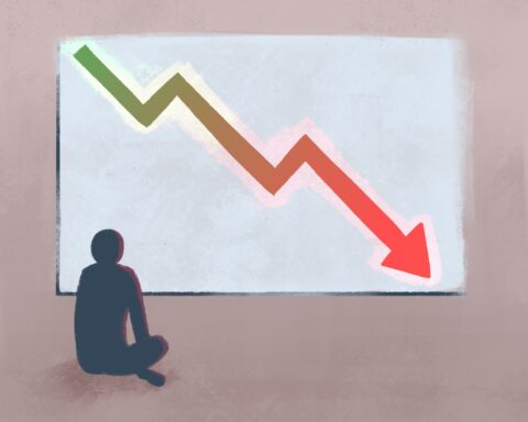 In an article about the "friendship recession," a figure sits in front of a board where there is an arrow on the decline."