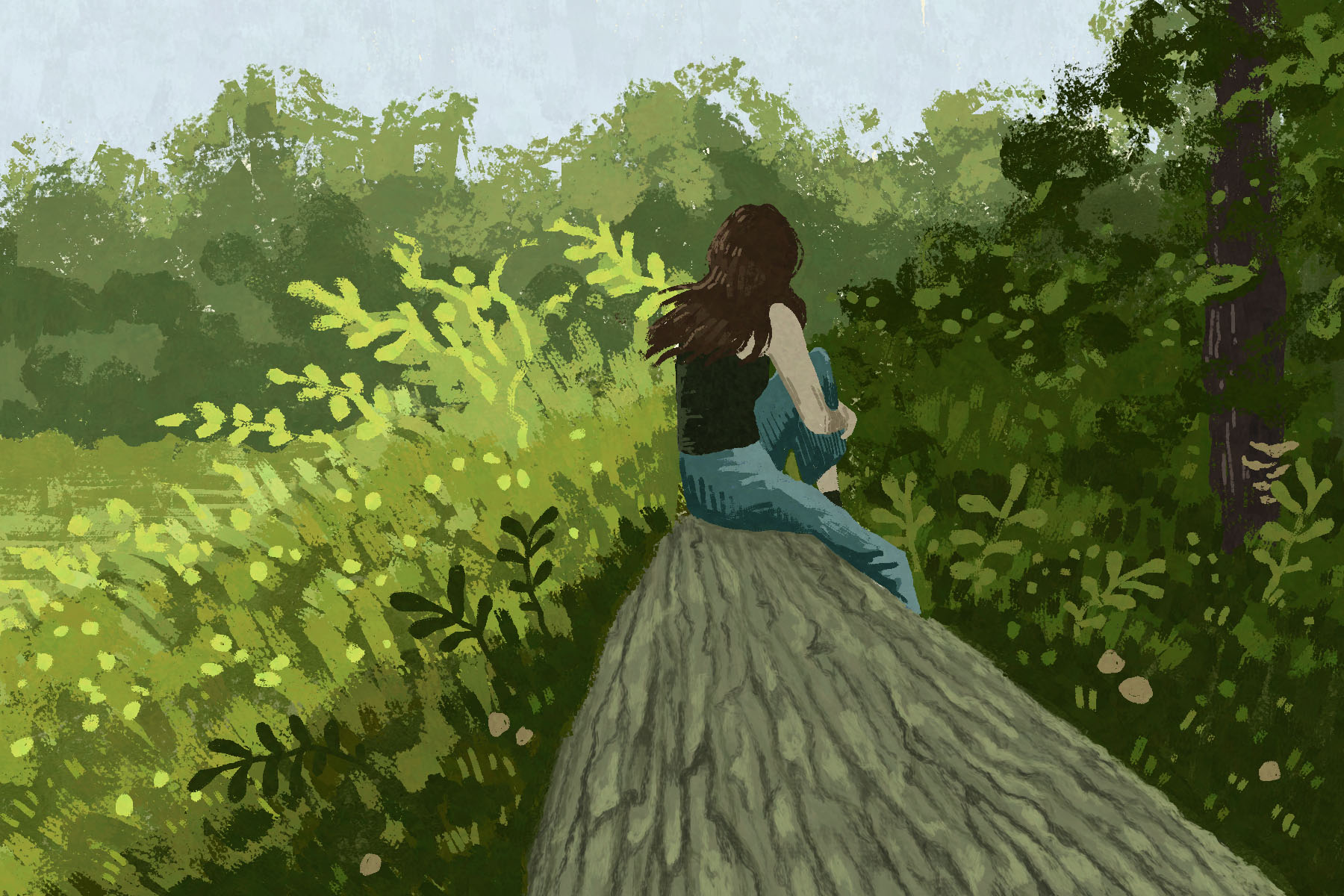 In an article about reconnecting with nature a girl with brown hair sits sits on a log among trees and other greenery.