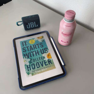 Photo of a book and water bottle on a table