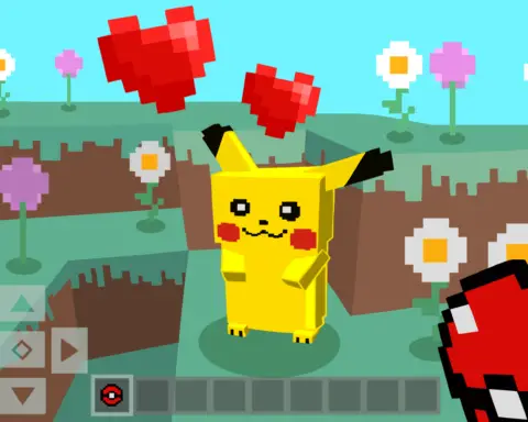 An unseen figure holding a red and white ball stares down a yellow, rabbit-like creature with black-tipped ears and red dots on its cheeks. The entire world is rendered in blocks, the scene set on a hill of green grass and brown dirt, dotted with daisies and violets, a blue sky in the background. Red, pixelated hearts float above the creature, with an arrow pad and line of squares lining the bottom.