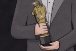 Awardee holding Oscar trophy.