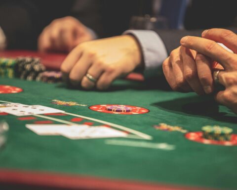 Hands on a Black Jack Table.