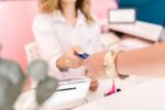 Woman making a purchase with a credit card