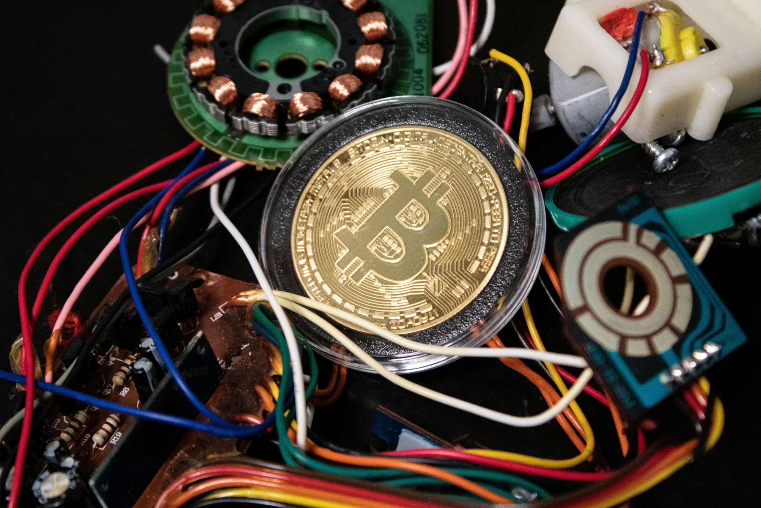 Gold Bitcoin with wires around it