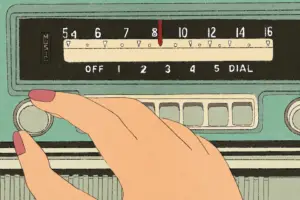 A hand turns a radio dial, their fingers painted with red nail polish. The knob is attached to a green case, a red needle switching between frequencies as it presumably turns. The needle glides over a yellow bar marked with black symbols, words and numbers, both housed within a black rectangle, the word "music" imprinted in gold on to their left.