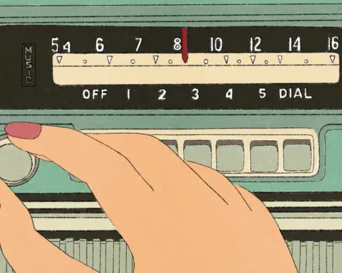 A hand turns a radio dial, their fingers painted with red nail polish. The knob is attached to a green case, a red needle switching between frequencies as it presumably turns. The needle glides over a yellow bar marked with black symbols, words and numbers, both housed within a black rectangle, the word "music" imprinted in gold on to their left.