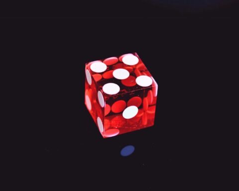 Red dice black background